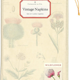 Wildflower napkins folded in muslin bag with a white sticker that reads" Vintage Napkins". The bag has a small sticker on the bottom right corner with a pink wildflower signifying the style of napkin thats in the bag.