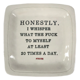 Ceramic plate with black hand pressed text.