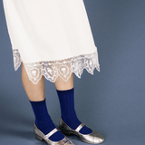 blue socks pair with a fun skirt and metallic silver shoes. 