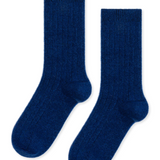 a pair of blue ribbed cashmere socks lay flat against a white background. 