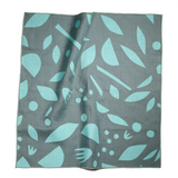Decon floral print displayed on a napkin that's loosley unwrapped and open. 