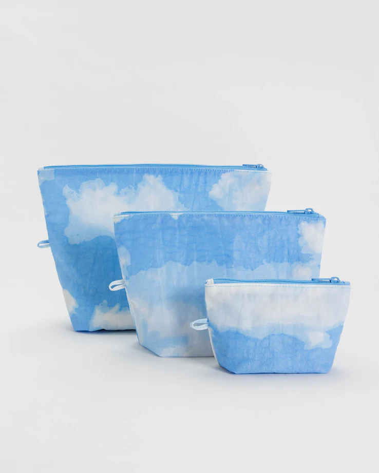 set of 3 pouches in various sizes all sharing the same realistic cloud print 
