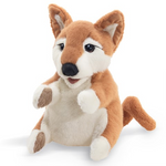 shiba inu puppy puppet in a sit position with a white background. 