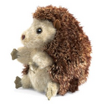 small brown hedgehog viewed from side profile. 