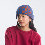 SIMPLE RIB HAT ON MODEL IN GREEN