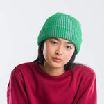 SIMPLE RIB HAT ON MODEL IN GREEN