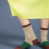 speckle crew socks worn with a fun textured skirt. 