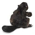 Back view of dark brown beaver hand puppet. Tail detail and fur detail pop out against white background. 
