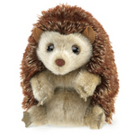small hedgehog puppet with brown tones and big endearing black eyes. 