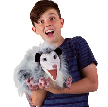 child holding the puppet making the same shocked face as the puppet. 