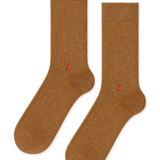 tan colored cashmere socks laid in front of a white background. 