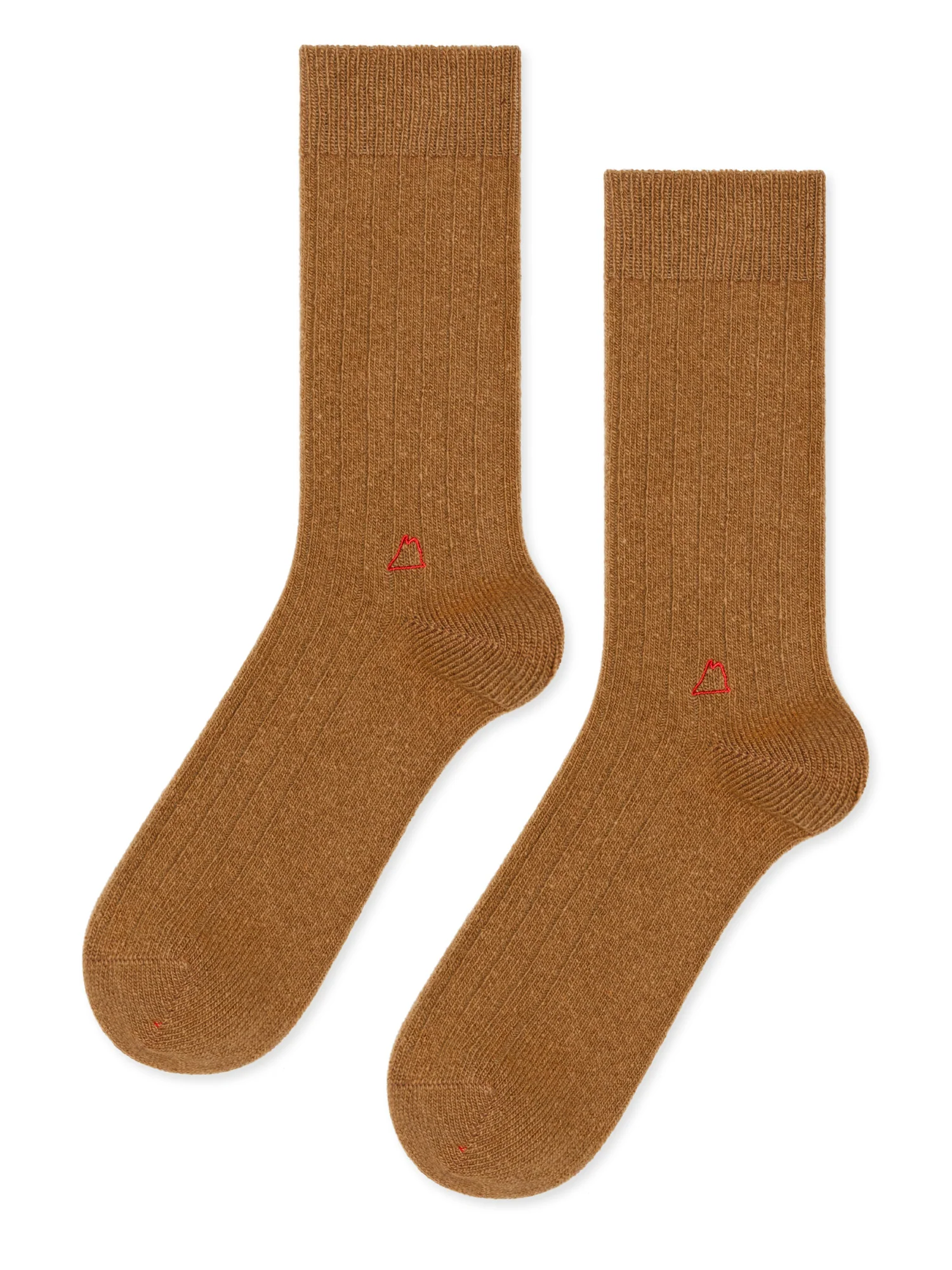 tan colored cashmere socks laid in front of a white background. 