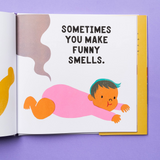 THIS IMAGE SHOWS THE BOOK OPEN TO A PAGE WHERE A BABY IS LAYING ON ITS BELLY AND THERES A SMELLY SIGNAL COMING FROM ITS DIAPER WITH TEXT THAT READS "SOMETIMES YOU MAKE FUNNY SMELLS"