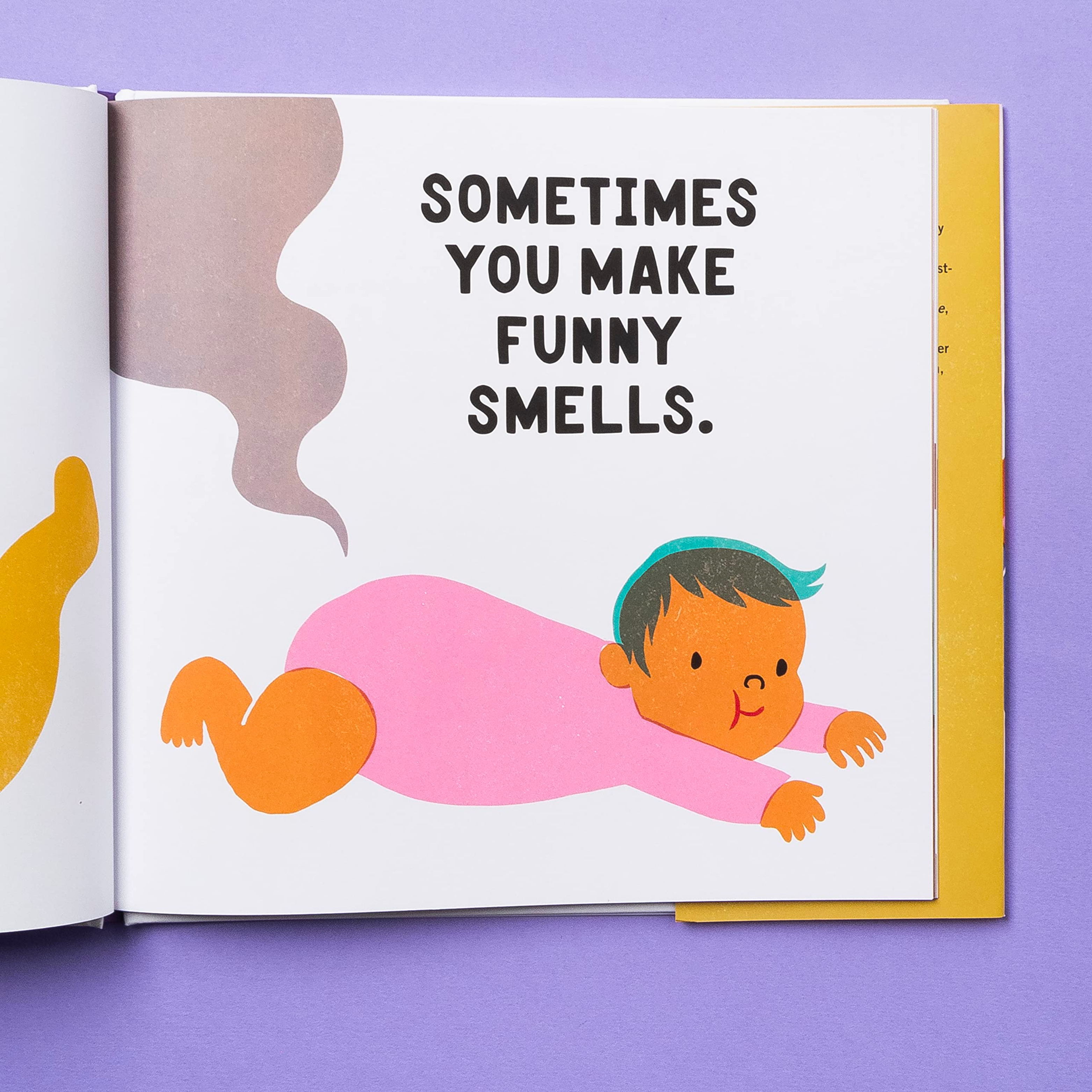 THIS IMAGE SHOWS THE BOOK OPEN TO A PAGE WHERE A BABY IS LAYING ON ITS BELLY AND THERES A SMELLY SIGNAL COMING FROM ITS DIAPER WITH TEXT THAT READS "SOMETIMES YOU MAKE FUNNY SMELLS"