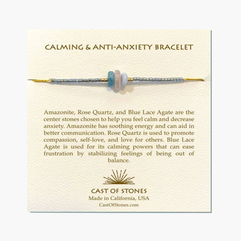 Bracelet displayed on a tan information card. Theres information on the stones and a company logo centered under the information.